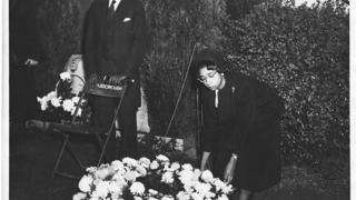 Carolyn Green Laying Wreath at Grave