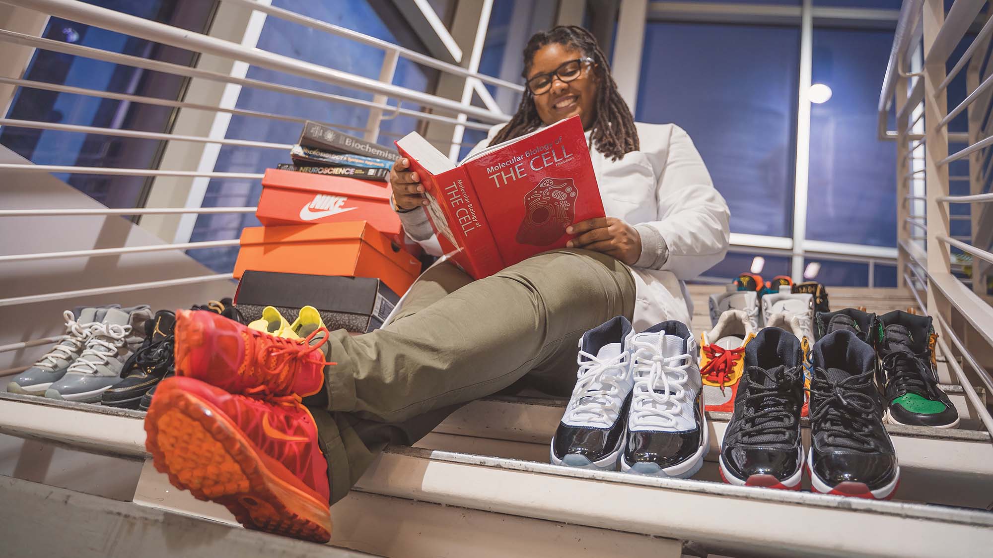 Kyla reading with sneakers