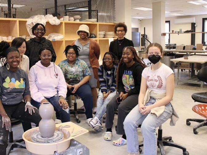 A group of studio arts students posing for a group photo