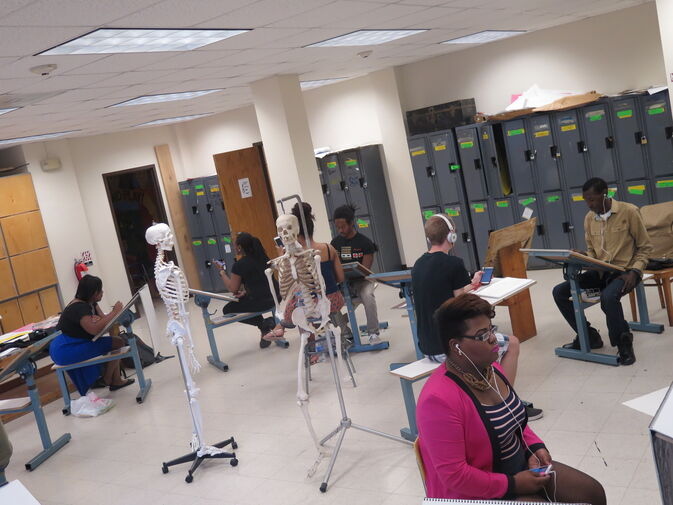 Several students sitting in a classroom 