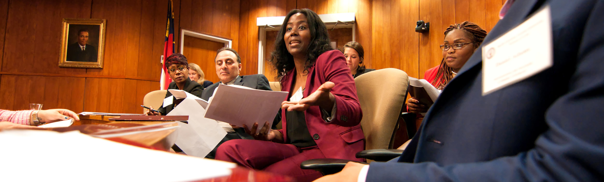 Image of law students in a courtroom setting