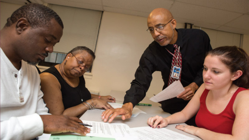 Psychology professor helping students 