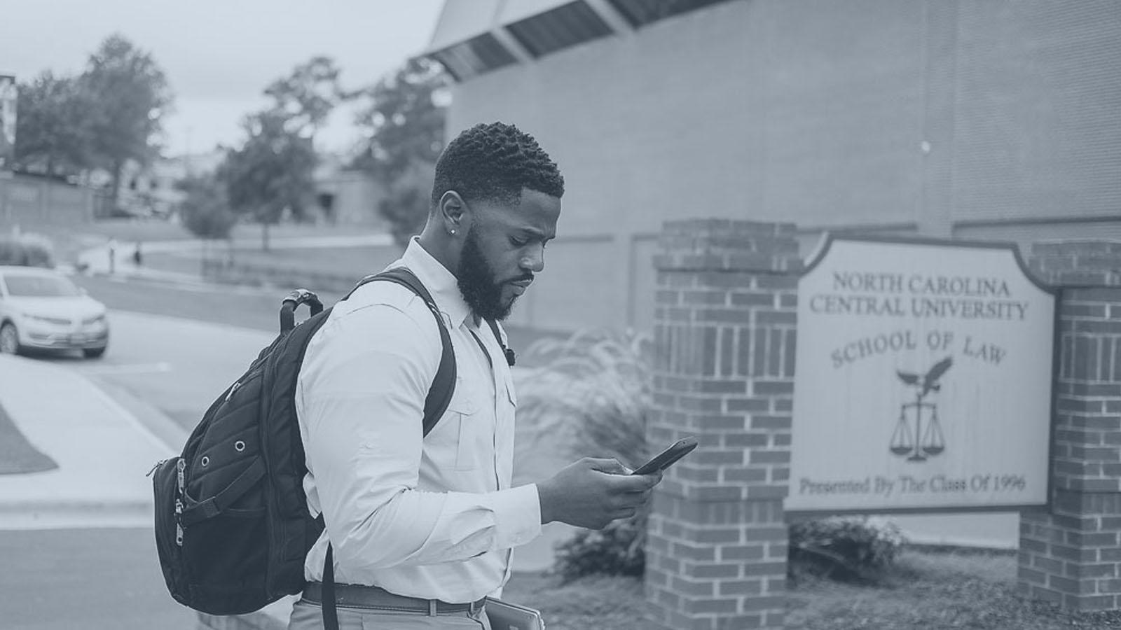 Student in Front of Law School