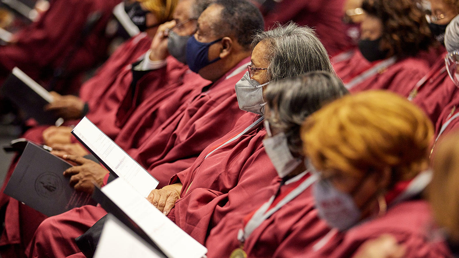 NCCU alumni sitting down for pinning ceremony