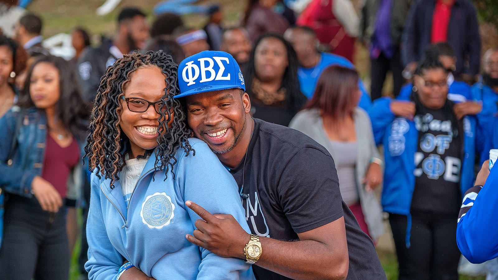 couple posing at the greek bowl social