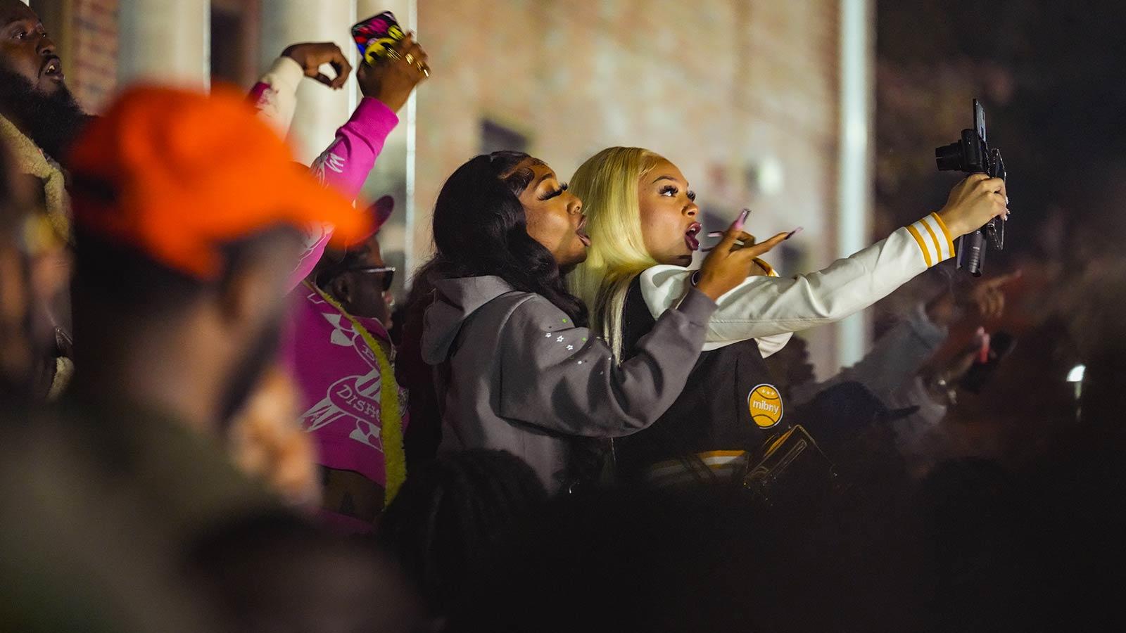 NCCU students at homecoming. Taking selfies with their phones