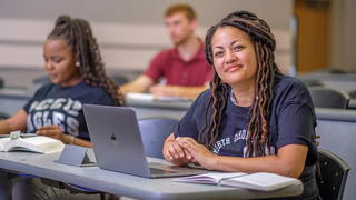 Students sitting inside classroom.