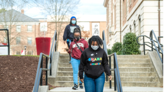 Students walking downstairs.