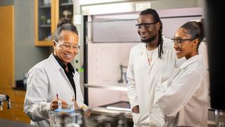 faculty and students in lab