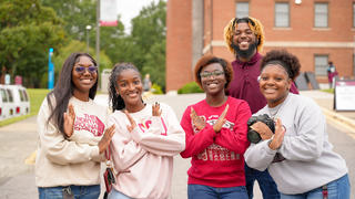 Multiple students smiling