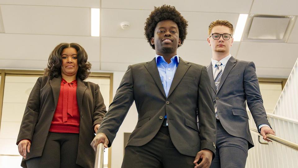 School of Business Students Walking Down Stairs