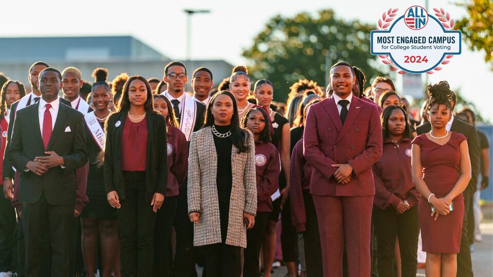 Chancellor Dixon and students marching to on-campus polling precinct