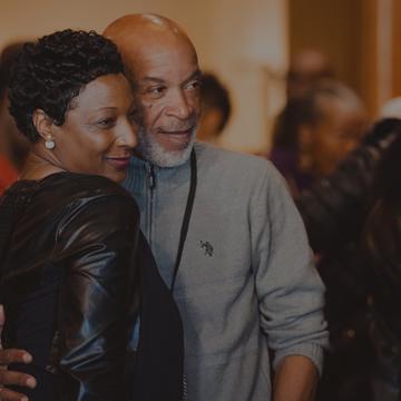 An NCCU alumni couple posing for a photo