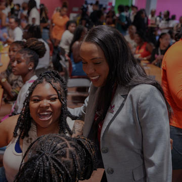 Chancellor with Students on Cafeteria