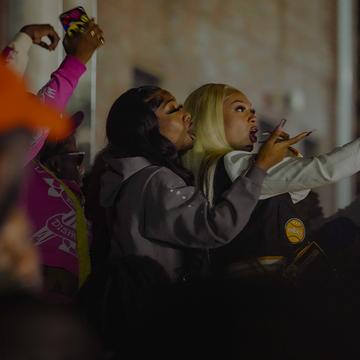 NCCU students at homecoming. Taking selfies with their phones