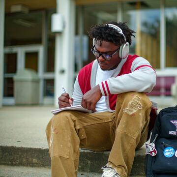 A NCCU student taking notes